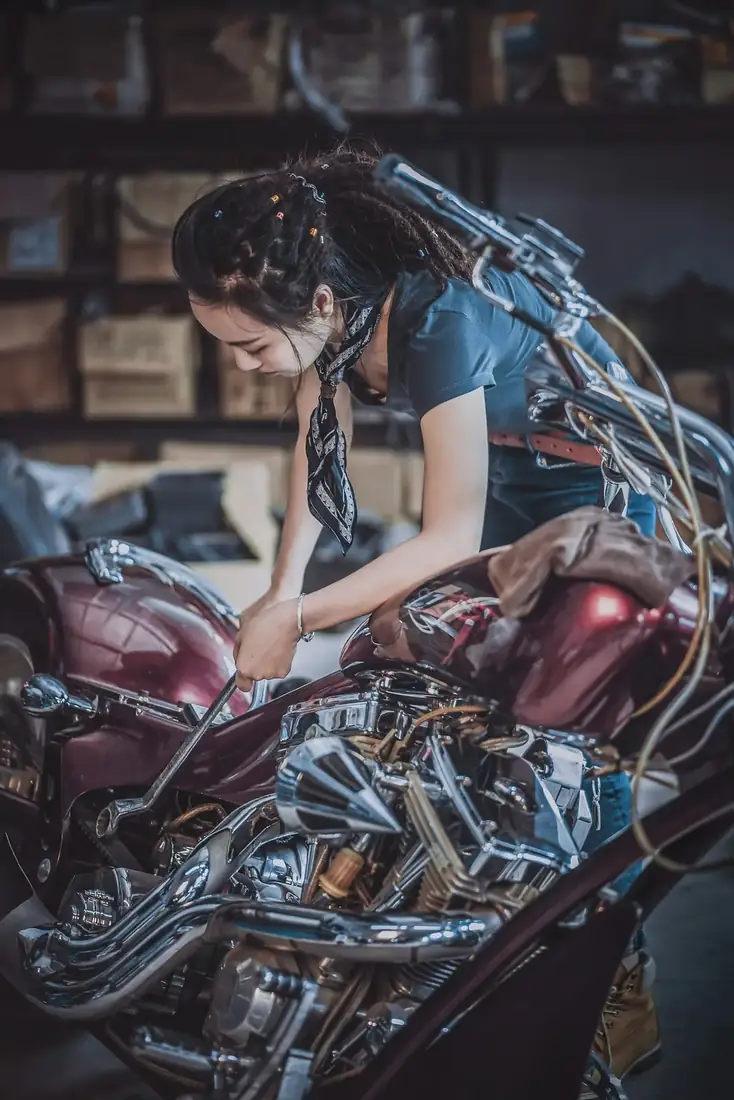 Motorcycle workshop where fasteners are fitted