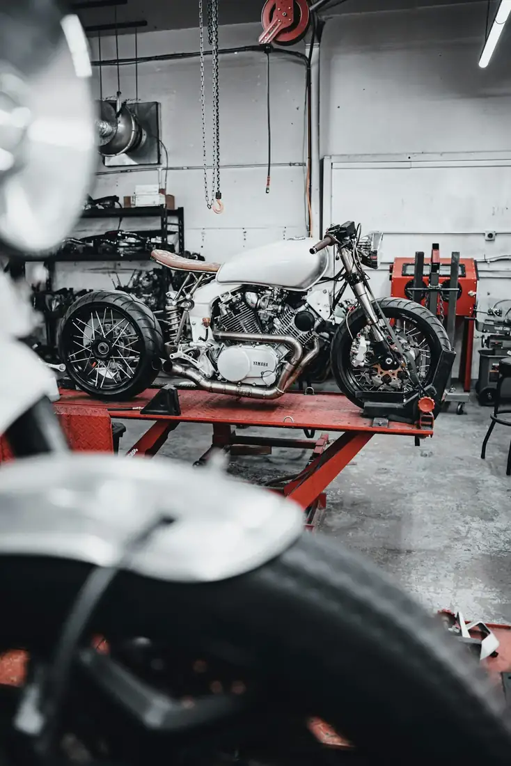 Motorcycle workshop where fasteners are fitted
