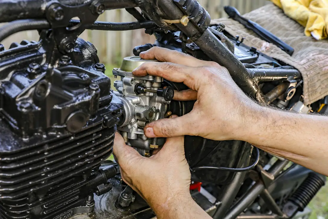 Motorcycle workshop where fasteners are fitted