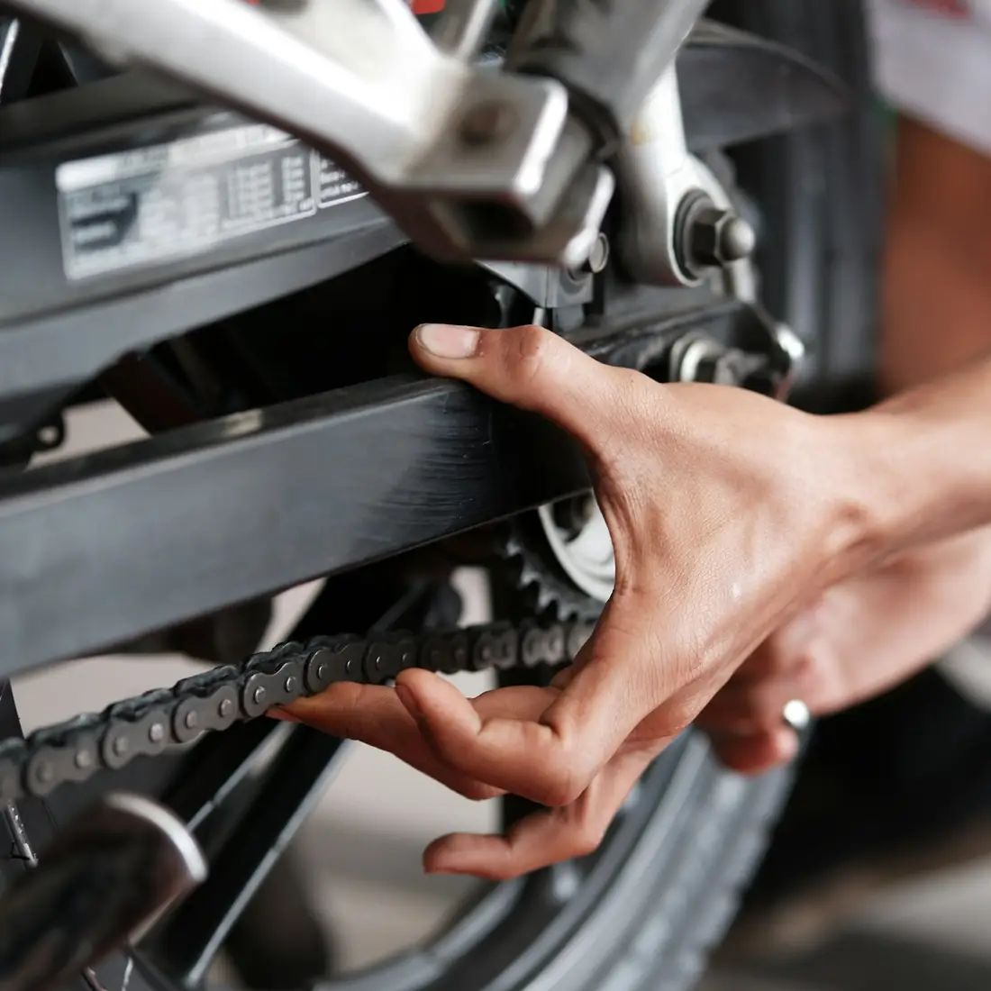 Motorcycle workshop where fasteners are fitted