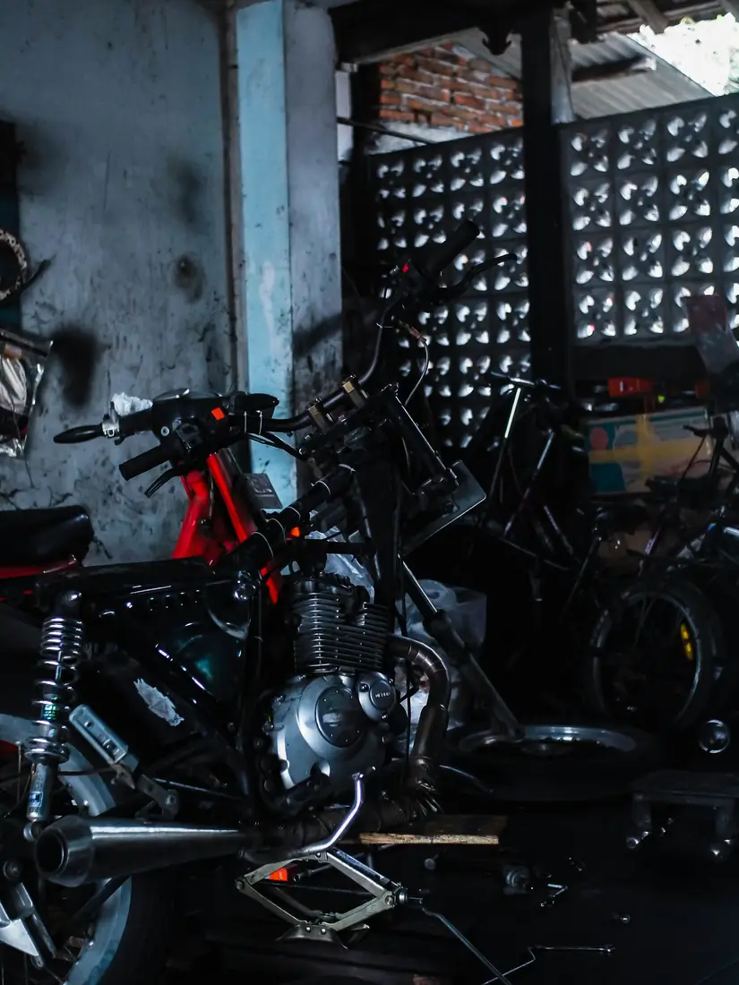 Motorcycle workshop where fasteners are fitted