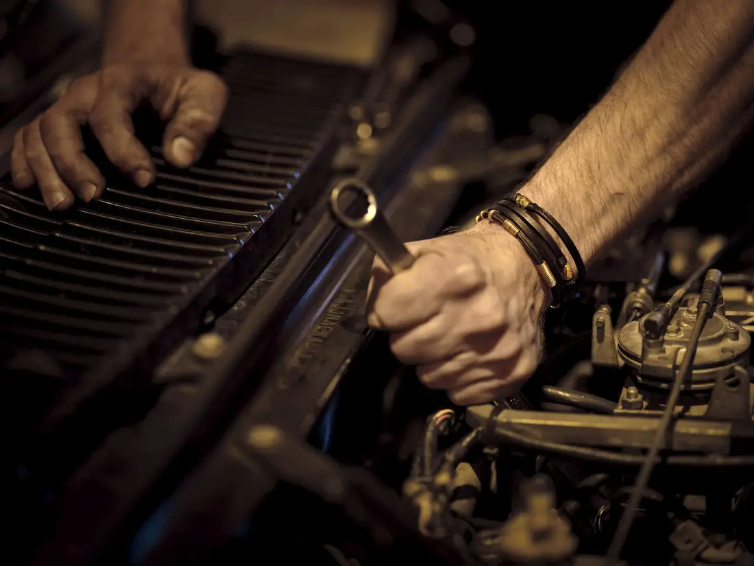 Motorcycle workshop where fasteners are fitted