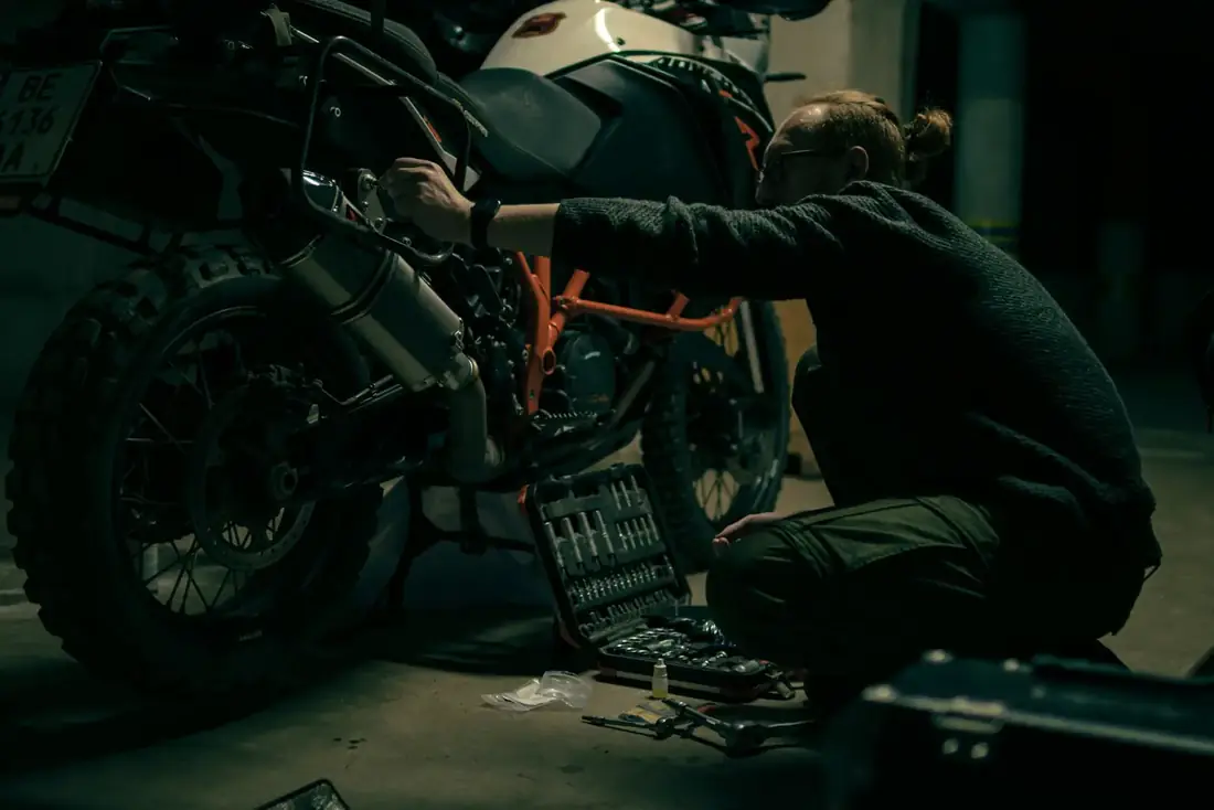 Motorcycle workshop where fasteners are fitted