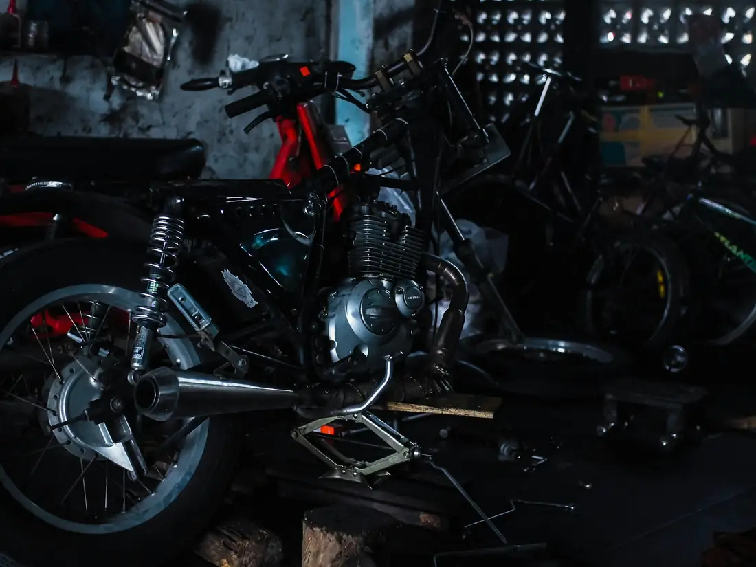 Motorcycle workshop where fasteners are fitted
